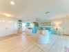 Sink into plush seating in your bright, beach-inspired living room, where coastal blues and generous space invite relaxation. Gather with family, unwind beneath the ceiling fan, and enjoy a home-away-from-home filled with comfort and charm.