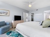 Primary bedroom with large flat-screen TV