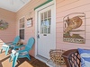 Enjoy a cup of coffee on the screened-in porch