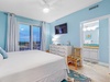 Bedroom 2 with balcony access and TV