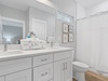 Primary bathroom with dual vanities