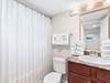 The guest bathroom features a shower/tub combo