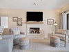 Large flat-screen TV and decorative fireplace