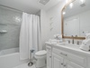 Guest bathroom with a shower/tub combo