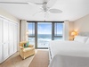 Guest bedroom with king bed and beach views