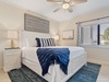 Guest bedroom 1 featuring a king bed
