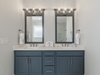 The master bathroom features a dual vanity