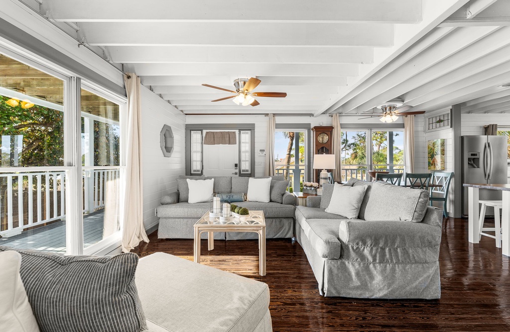 Relax in this bright living room with comfortable seating and natural light.