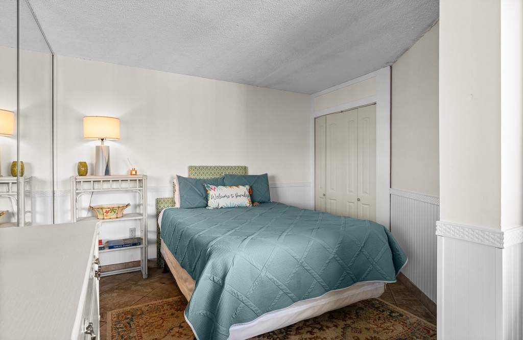 Cozy bedroom with a cozy bed and soft lighting for a restful stay