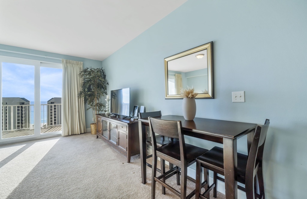 Relax in this bright living area with ocean views and modern furnishings.