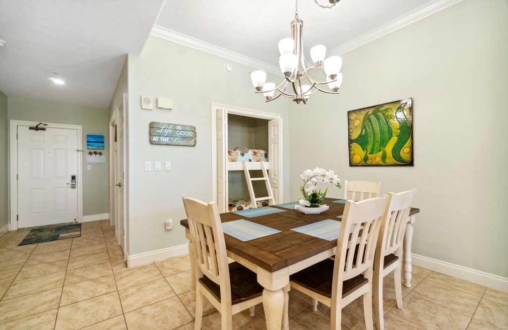 Cheerful dining area w/ chandelier lighting & seating for the whole group.