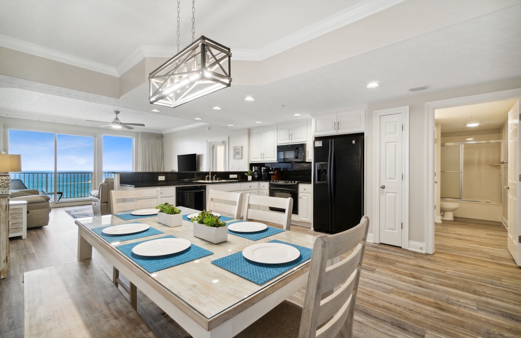 Open-concept kitchen and dining area with ocean views and modern finishes