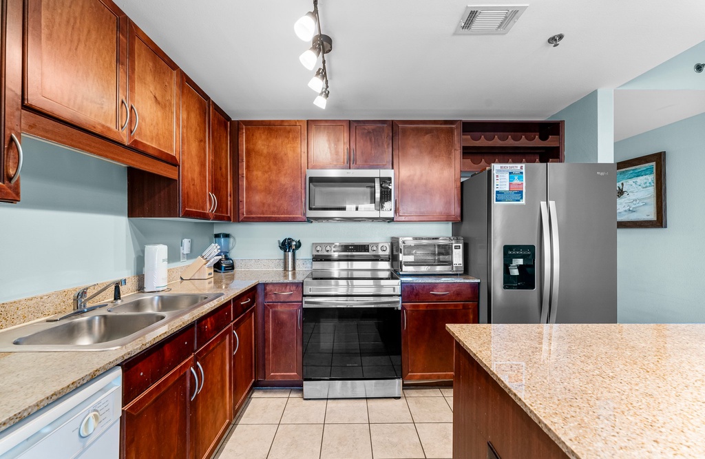 Modern kitchen with stainless steel appliances and granite countertops