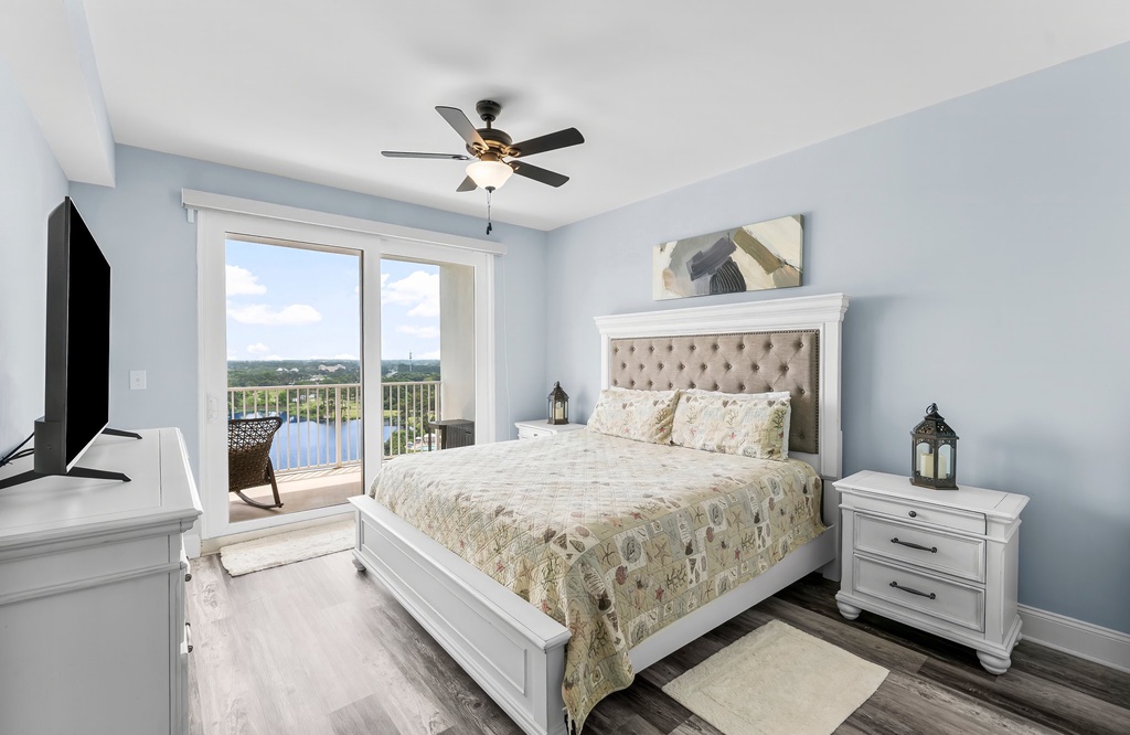 Relax in this modern bedroom with a balcony overlooking the water.