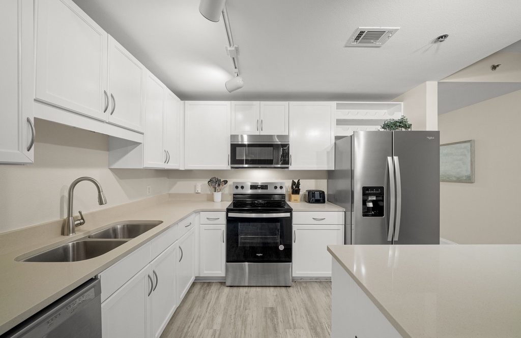 Modern kitchen with stainless steel appliances and ample counter space