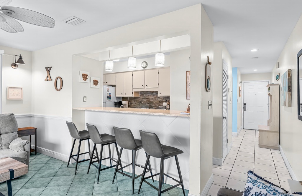 Modern kitchen with a breakfast bar and seating for four.