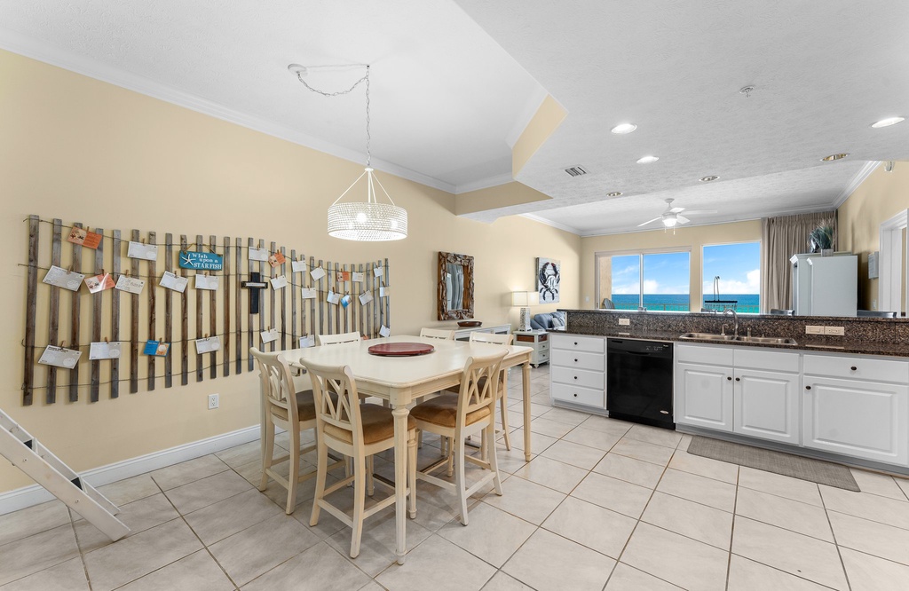 Open kitchen and dining area with ocean views and natural light