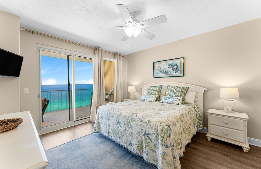 Relax in this coastal bedroom with ocean views and access to a private balcony.