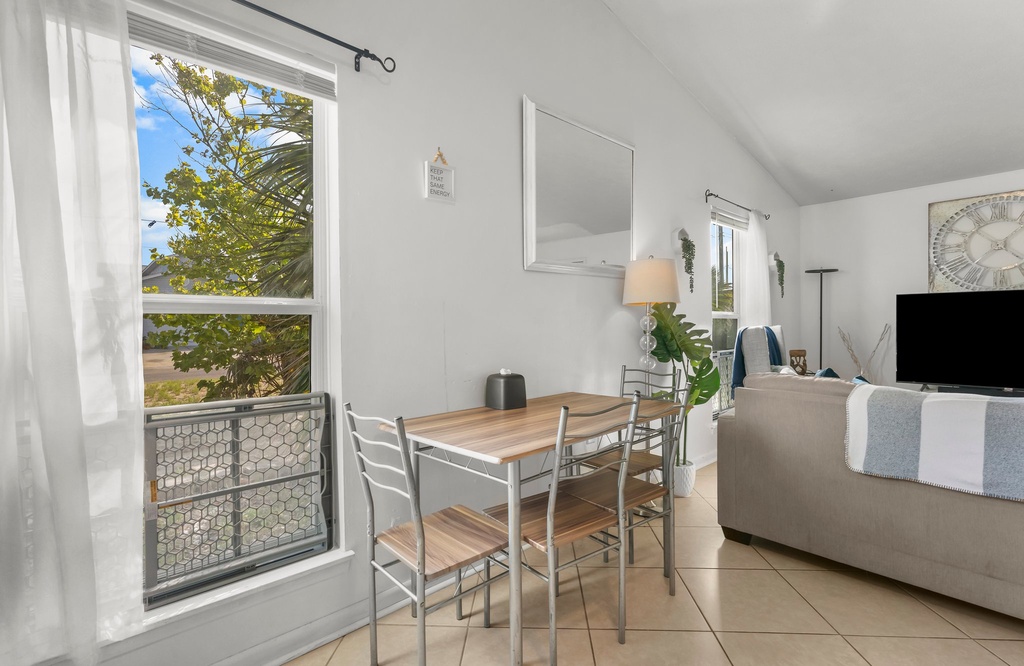 dining area with natural light and a view of greenery through the window