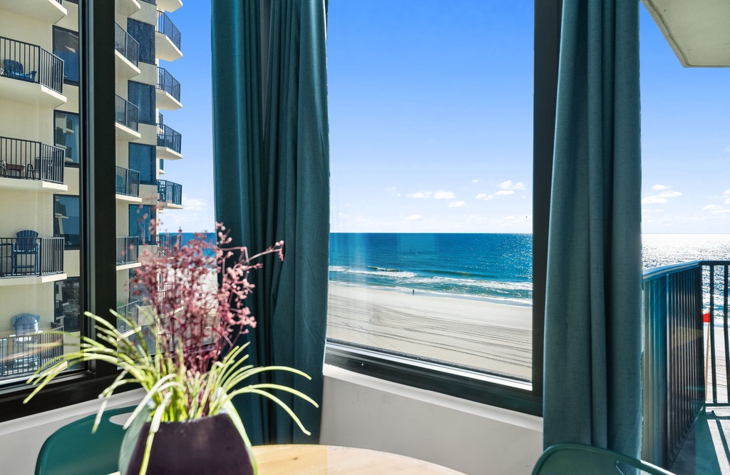 Wake up to stunning ocean views stretching endlessly before you, where azure waters meet pristine sand just steps from your balcony door.