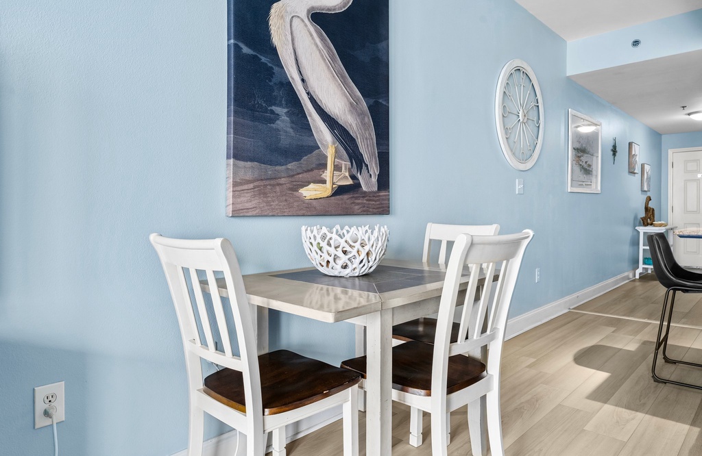 Cozy dining nook with a coastal-themed decor and natural light.