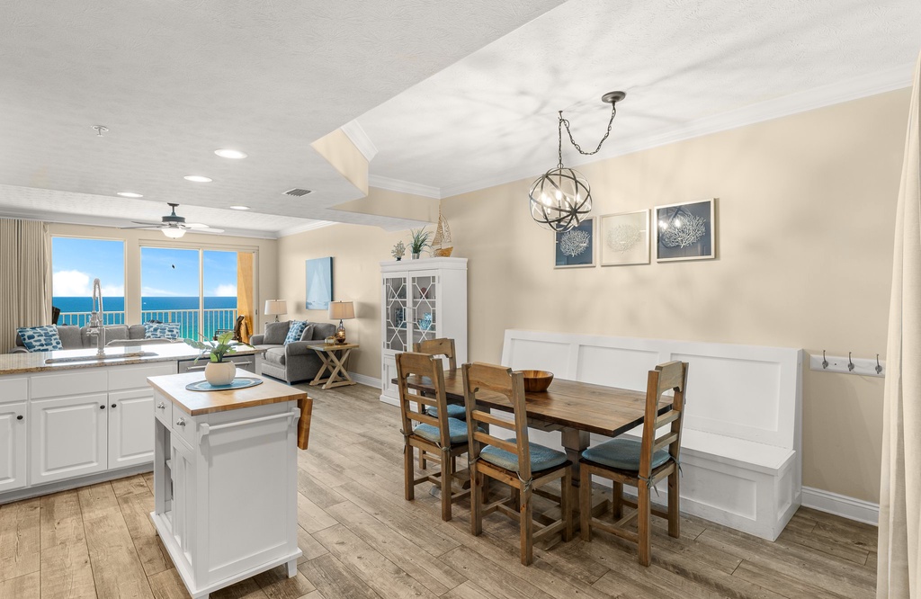 Open dining and living area with ocean views and modern coastal decor