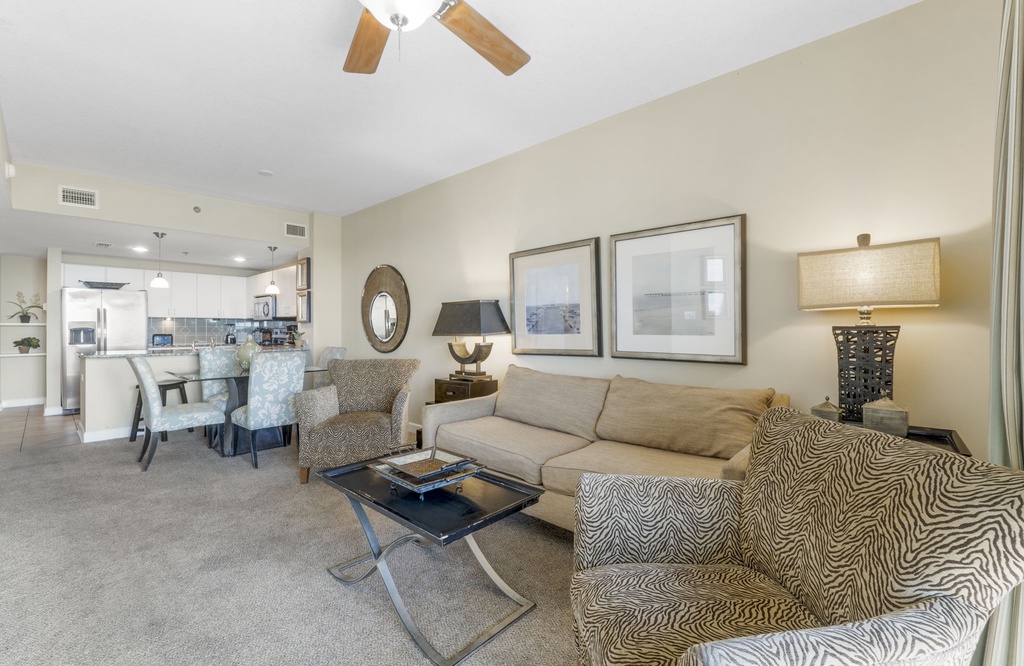 Spacious living area with comfortable seating and an open kitchen layout