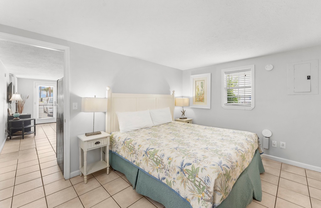 bright and simple bedroom with a bed and natural light