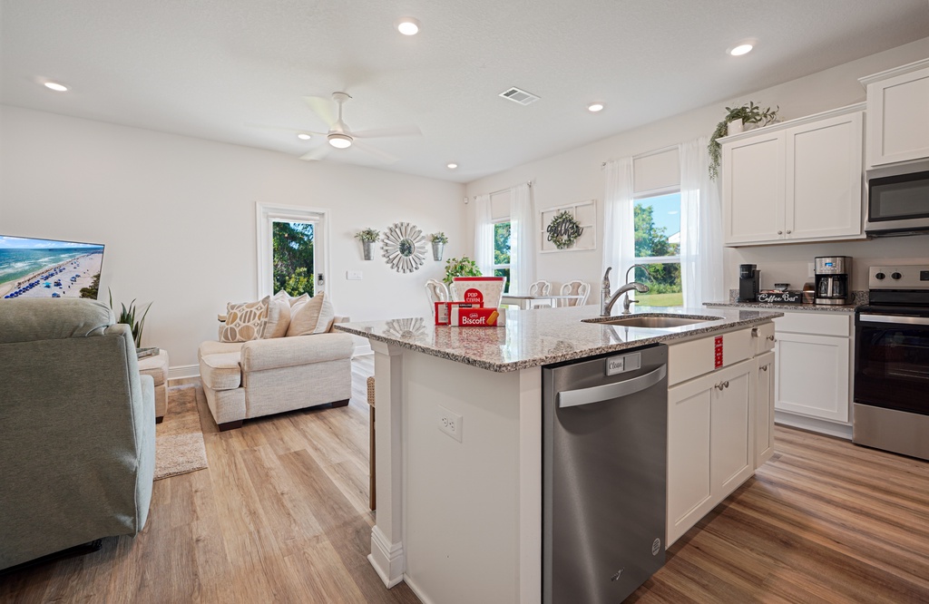 Your bright open-concept kitchen flows seamlessly into the cozy living space, perfect for preparing meals while staying connected with family.