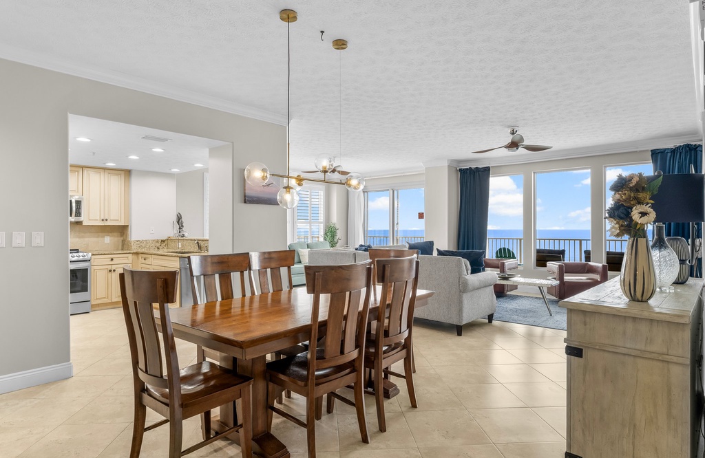 Spacious dining area with ocean views and modern decor.