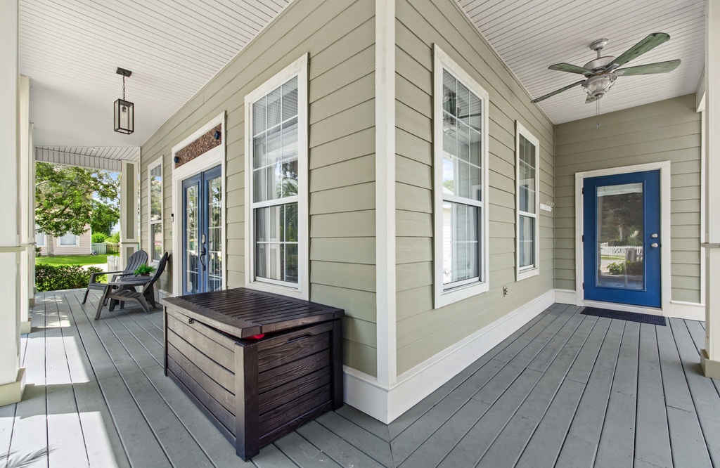Your wraparound porch invites you to settle into the shade and unwind, whether enjoying morning coffee or evening conversations under the ceiling fan's gentle breeze.