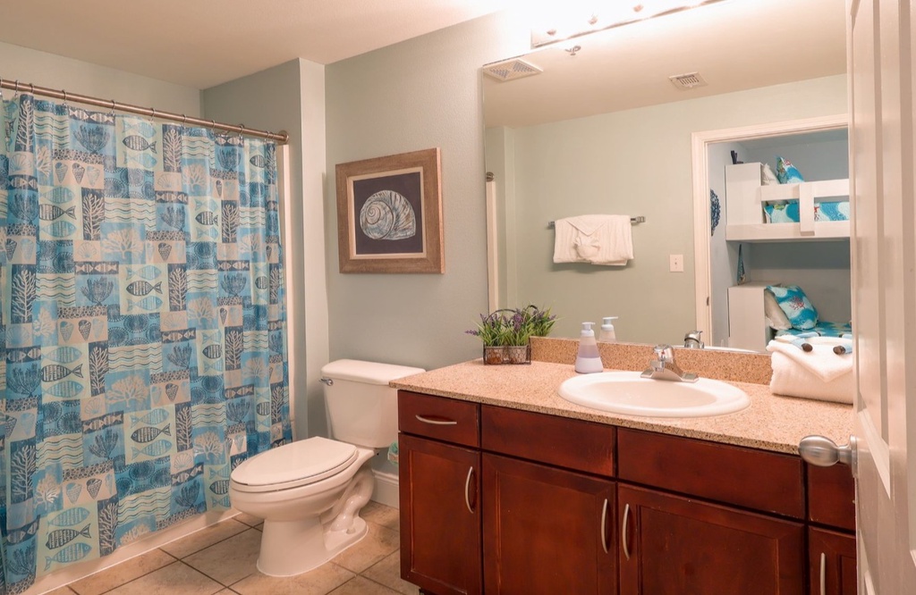 Refresh in your private bathroom with coastal-inspired touches, a full vanity, and plenty of storage for all your essentials.
