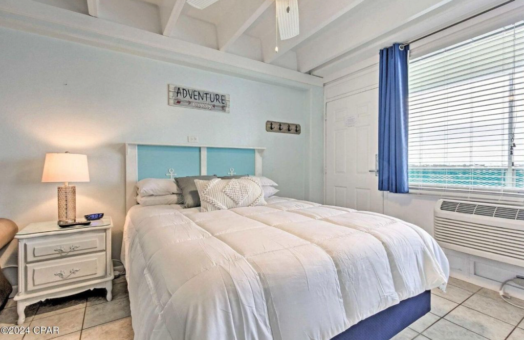 Wake refreshed in your bright, beachy bedroom with vaulted ceilings, coastal décor, and calming water views just outside your window.