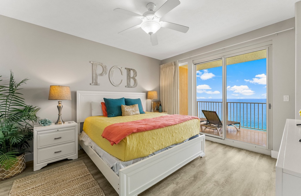 Relax in this bright bedroom with ocean views and direct balcony access.