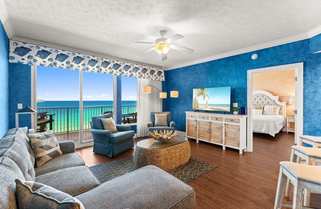 Relax in your bright beachfront living room with stunning ocean views, cozy seating, and coastal décor.