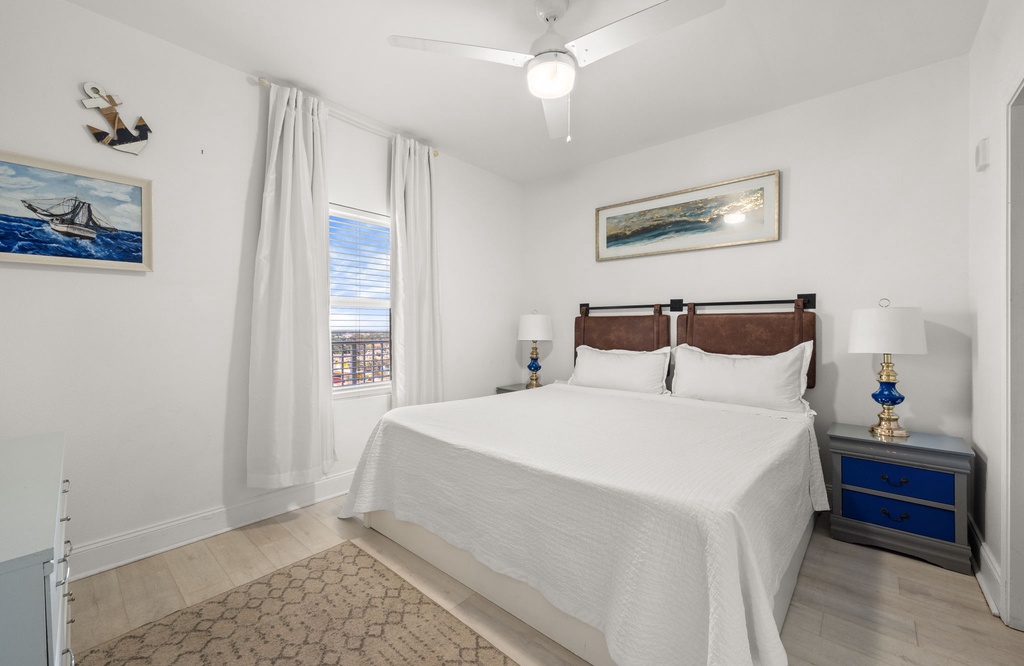 Bright bedroom with a comfy bed and coastal-inspired decor.