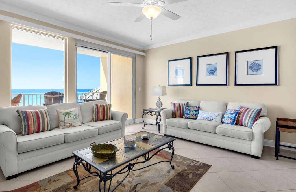 Relax in your bright living room where ocean breezes and stunning sea views create the perfect backdrop for unwinding after beach days.