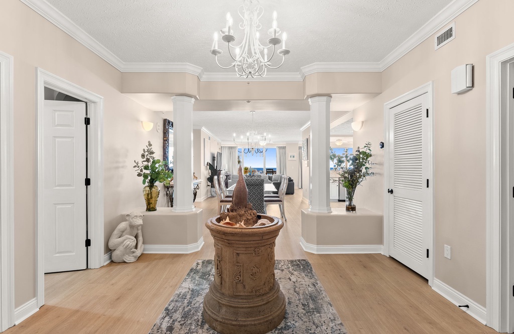 Step into elegance where gleaming hardwood floors and soaring ceilings welcome you home to sophisticated coastal living.