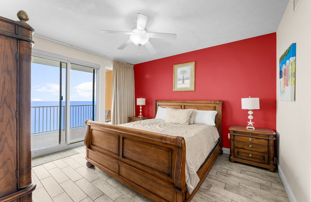 Relax in this coastal bedroom with ocean views and classic wooden furniture.