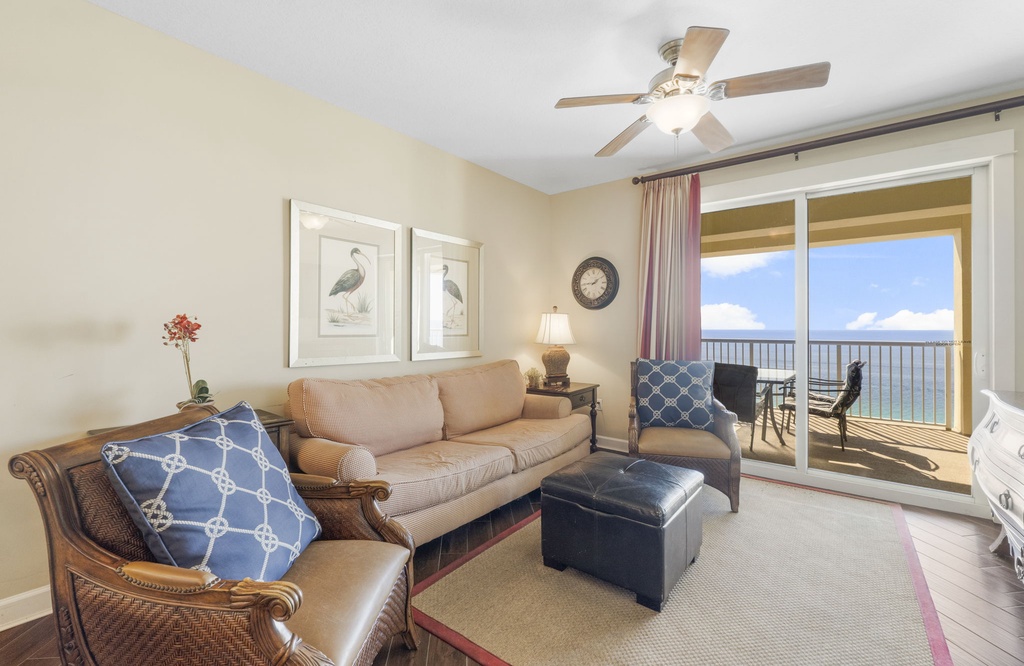 Living room with ocean view and access to a balcony seating area