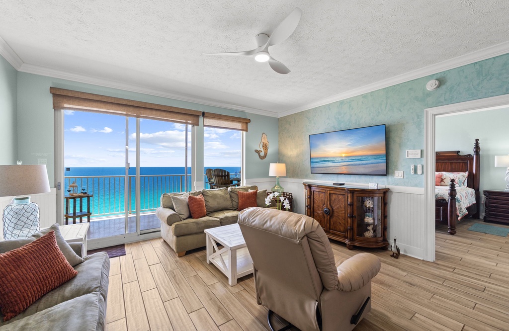 Relax in this coastal living room with ocean views and natural light.