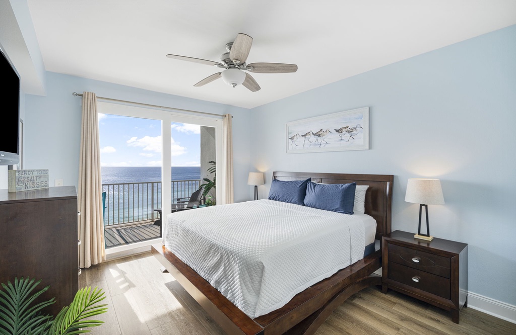 Relax in this bright bedroom with ocean views and modern decor.