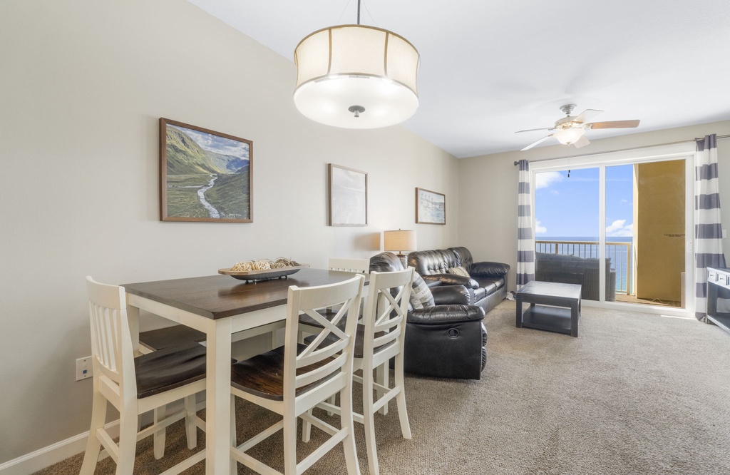 Open living and dining area with ocean views and natural light