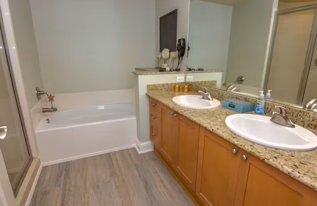 Your private bathroom offers dual vanities with granite countertops and a relaxing soaking tub—perfect for unwinding after a day of adventure.