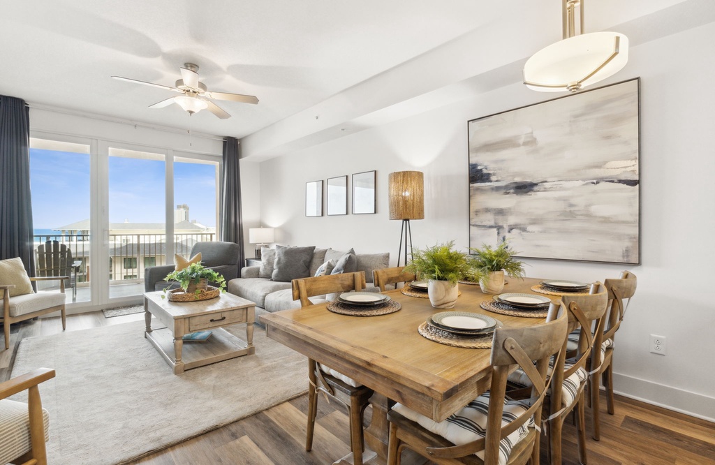 Modern dining and living area with balcony views and natural light