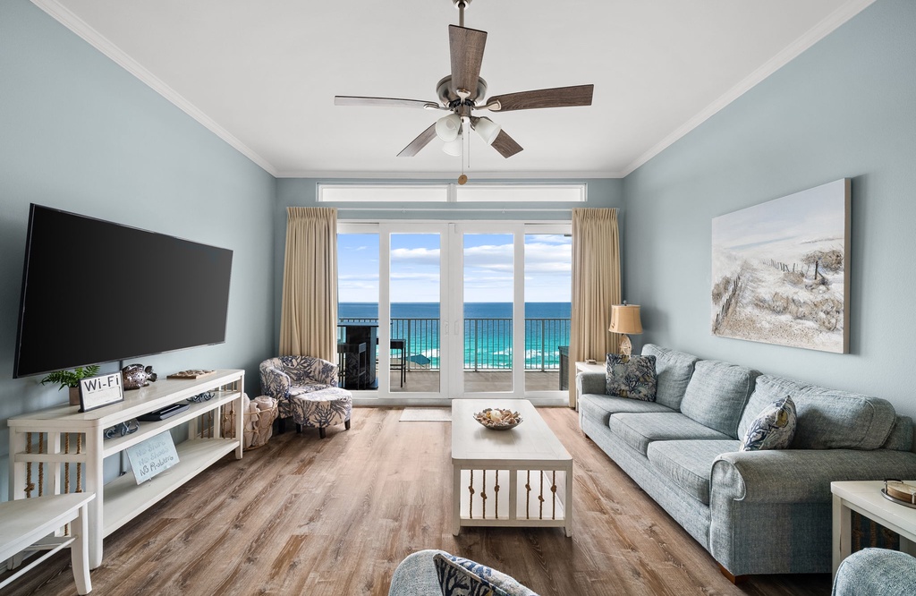 Unwind in your bright living space with stunning ocean views through floor-to-ceiling windows and comfortable seating for relaxing evenings.