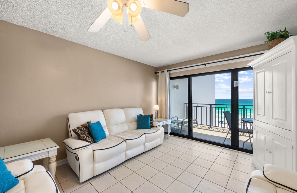 Relax on your plush sofa while ocean breezes flow through sliding doors to your private balcony overlooking turquoise waters.