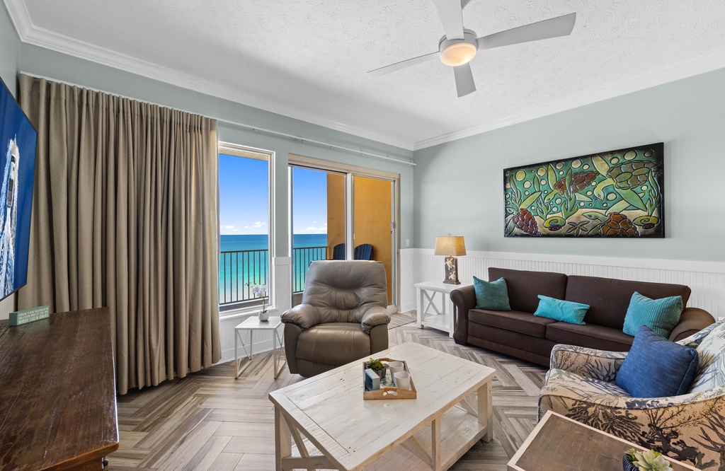 Relax in your bright, coastal-inspired living room where turquoise waters stretch beyond your private balcony. The soothing ocean breeze and stunning views make every moment unforgettable.