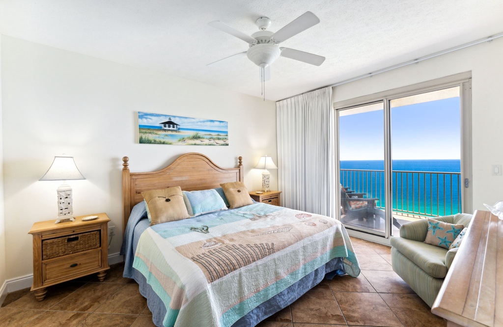Relax in this bright bedroom with ocean views and direct balcony access.