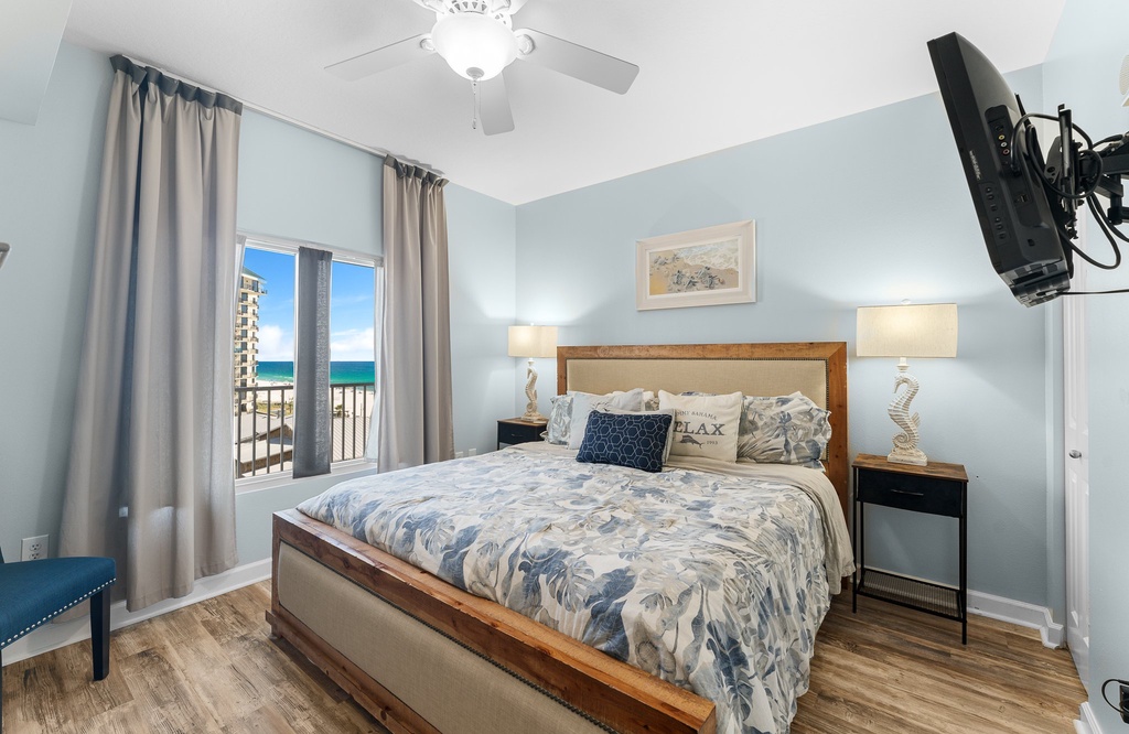 Relax in this coastal-inspired bedroom with ocean views and natural light.